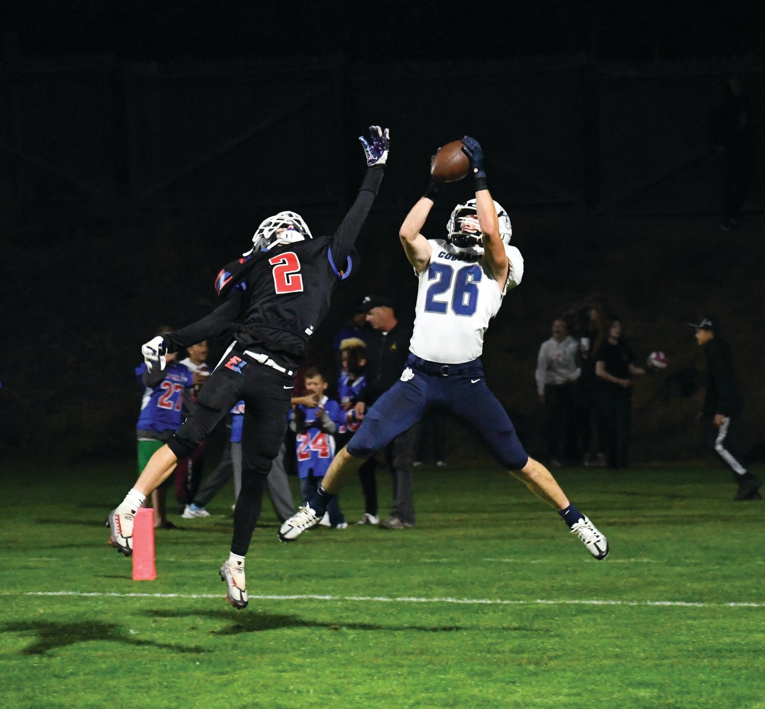 East Jefferson's Brody Moore tries to break up a pass play during the Rivals matchup against Cascade Christian.